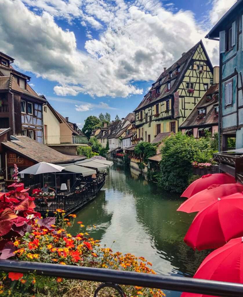 red umbrella on river near houses